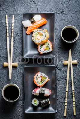 Sushi for two served on black stone