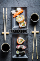 Fototapety Sushi for two served on black stone