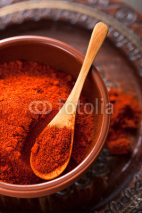 Naklejki red ground paprika spice in bowl