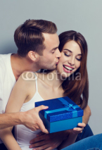 Happy couple with blue gift box