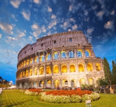 Naklejki Colosseum - Rome. Night view with surrounding grass and park