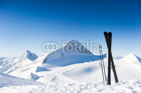 Naklejki Skis in high mountains at sunny day