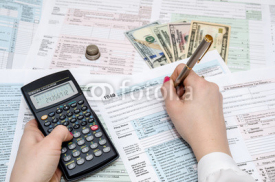 Naklejki woman hand filling in individual return tax form
