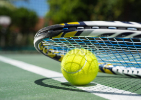 Naklejki Close up view of tennis racket and balls on  tennis court