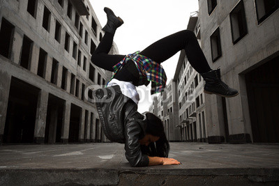hip-hop dancer girl posing on the deserted streets