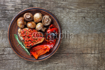 grilled vegetables and meat on the plate top view